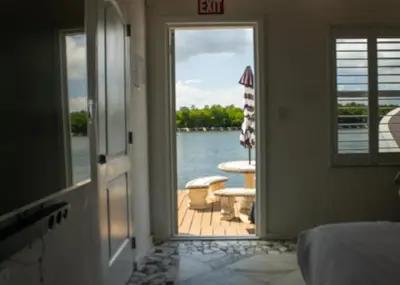 a door leading into a room with a view of the water at Komffy Studio with King Bed in Hollywood