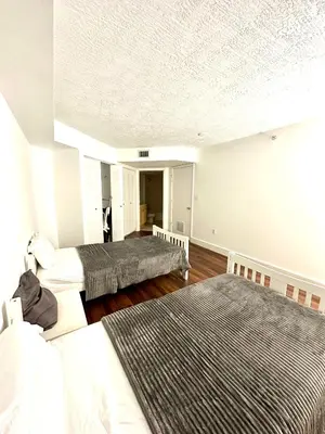 a bedroom with two beds and a white ceiling at Private bedroom 1 block from Downtown Miami in Miami