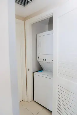 a kitchen with a white refrigerator and a microwave at Luxury 2 Bedroom Ocean View en Hyde Resort in Hollywood
