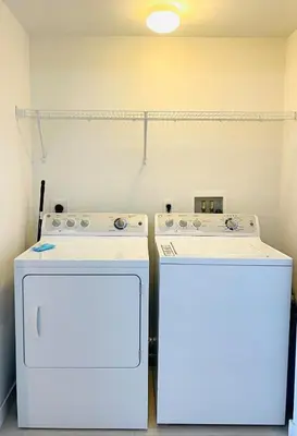 two white appliances sitting next to each other in a room at Beachwalk -1 Bedroom W-Kitchen and Great Views in Hallandale Beach