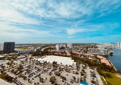an aerial view of a city with a parking lot at Beachwalk Studio W-Kitchenette Beach Pool Gym in Hallandale Beach