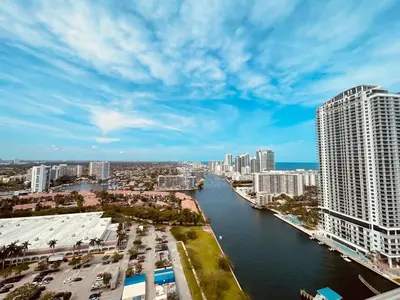 a view of a river in a city with tall buildings at Beachwalk Studio W-Kitchenette Beach Pool Gym in Hallandale Beach