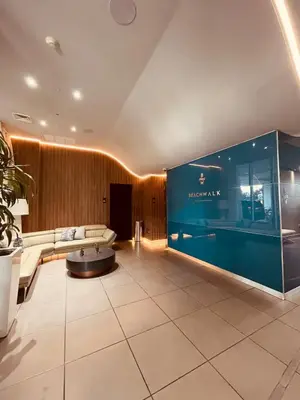 a large lobby with a couch and a table at Beachwalk Studio W-Kitchenette Beach Pool Gym in Hallandale Beach