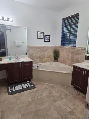 a bathroom with a tub and a sink and a bath tub at D&N Property Rental in Miami