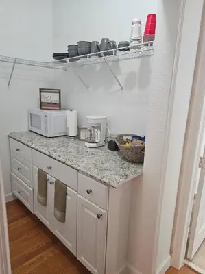 a kitchen with a counter top with a microwave at D&N Property Rental in Miami