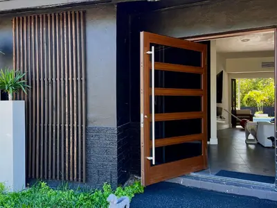 an open door to a house with a patio at Casa Olan - Luxury Family Oasis 3BR North Miami Beach Villa with Saltwater Pool & Canal Views in Miami