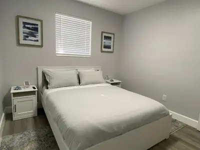 a white bedroom with a bed and a window at Rachaels Upscale 3 bedrooms Luxury Home in Fort Lauderdale