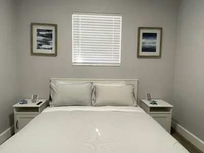 a bedroom with a large bed with two night stands at Rachaels Upscale 3 bedrooms Luxury Home in Fort Lauderdale