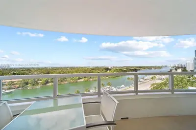 a balcony with a view of a river at Fontainebleau Miami Beach Junior Suite in Miami Beach