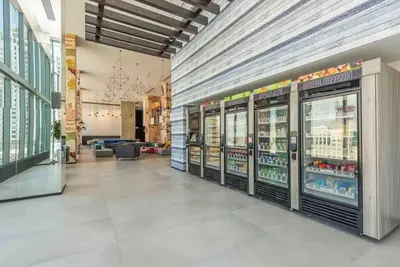 a store aisle with refrigerators in a shopping mall at Luxurious Unit in Miami in Miami