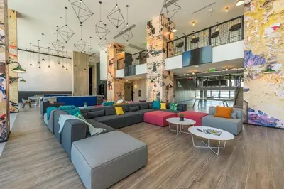 a lobby with couches and tables in a building at Exceptional property in the heart on downtown Miami in Miami