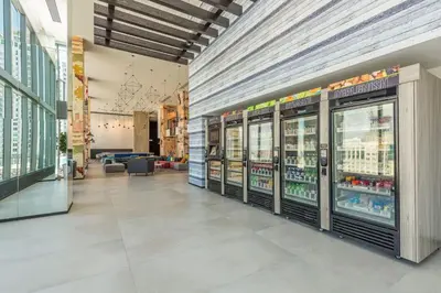 a store aisle with refrigerators in a store at Exceptional property in the heart on downtown Miami in Miami