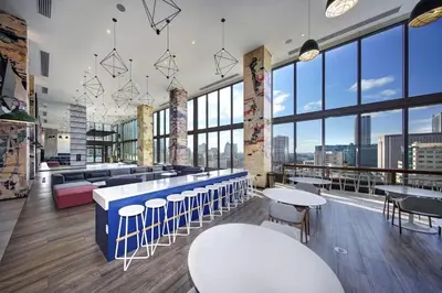 a restaurant with tables and chairs and large windows at Exceptional property in the heart on downtown Miami in Miami