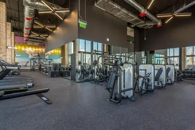 a gym with a bunch of treadmills and machines at Majestic unit in the heart of Downtown Miami in Miami