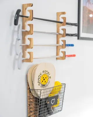 a basket of plates and a plate holder on a wall at 5BR HotTubPoolTableMiniGolf 7 min to Wynwood in Miami