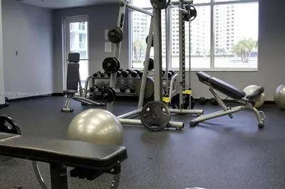 a gym with a fitness room with weights and machines at Entire Condo in Brickell steps from Brickell City Centre in Miami