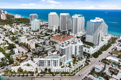 an aerial view of a city with tall buildings and the ocean at The Glamour of Upscale Downtown Ft. Lauderdale in Fort Lauderdale