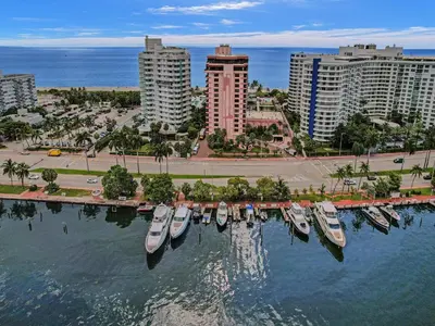 a group of boats docked in a harbor in a city at Cozy Beachfront 2 BDR Miami Beach Condo 1516 in Miami Beach