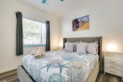 a bedroom with a bed with a teddy bear on it at Near Haulover Park Hollywood Cottage with Yard! in Hollywood