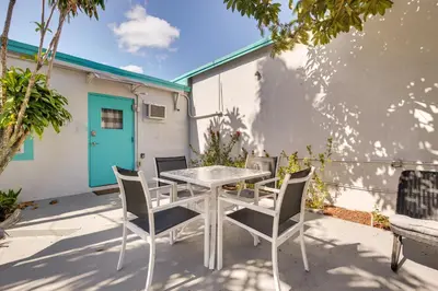 a white table and chairs on a patio at Near Haulover Park Hollywood Cottage with Yard! in Hollywood