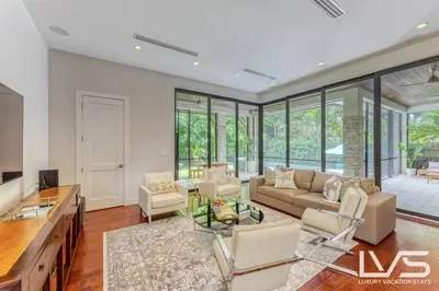 a living room with a couch and a table at Victoria Villa - Walk to Las Olas - 4 Bed 4 Bath in Fort Lauderdale