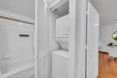 a white bathroom with a shower and a bath tub at Sublime 1 BED 1 BTH • Brickell BAY & CITY VIEW in Miami