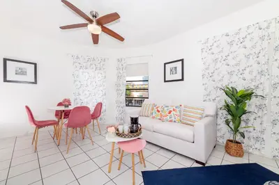 a living room with a couch and a table at Art Deco Washingthon Apartment in Miami Beach