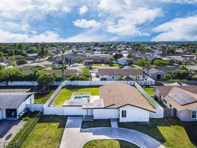 an aerial view of a residential neighborhood with houses at Chic Miami Private Pool Home in Cutler Ridge