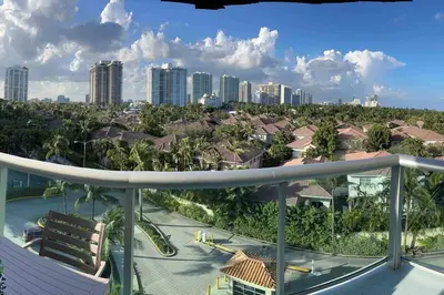a balcony with a view of a city at Cozy newly furnished apartment , on the 6th floor. in Sunny Isles Beach