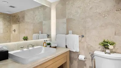 a bathroom with a white sink and a toilet at Luxurious Private Condo at 1 Hotel & Homes - 1545 in Miami Beach