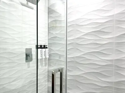 a shower with a glass wall at Sunny Resort Oasis with Heated Pool Ping Pong in Tamiami