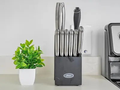 a knife block sitting on a counter next to a plant at X Lounge-Contemporary Corner Residence in Miami