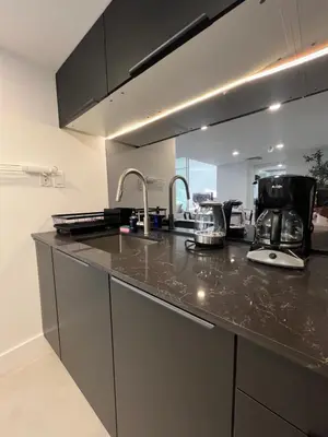 a kitchen with a sink and a counter top at Shaomi South Beach in Miami Beach