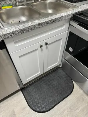 a kitchen with white cabinets and a sink and a rug at Apartamento en kendall Miami 2 Habitaciones y 3 baños in Miami