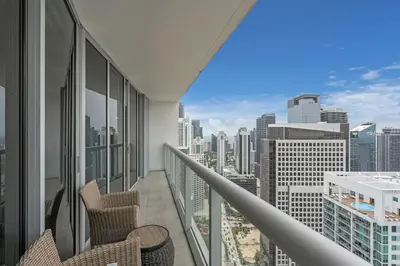 a balcony with chairs and a view of the city at Lovely 1BR W Icon Brickell-FREE SPA in Miami