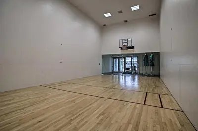 an empty gym with a basketball hoop and a wooden floor at Walk to Hollywood Beach Upscale 16th-Floor Condo in Hollywood