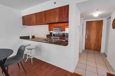 a kitchen and dining room with a table and chairs at Bay View 1 BDR 1 BTH • Brickell • Free Parking in Miami