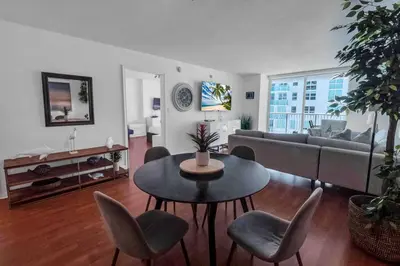 a living room with a couch and a table and chairs at Bay View 1 BDR 1 BTH • Brickell • Free Parking in Miami