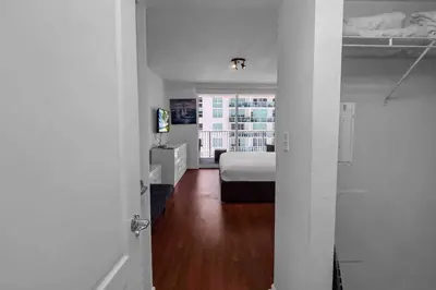 a white room with a bed and a window at Bay View 1 BDR 1 BTH • Brickell • Free Parking in Miami