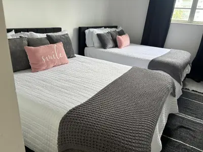 two beds in a room with two bedsskirts at #310 Sunny Isles Ocean Reserve with FREE Parking include in Sunny Isles Beach