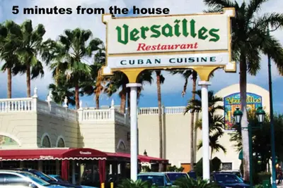 a sign for a restaurant in front of a building at B2 Best Value on Private Bedroom with Private Bathroom in Little Havana, Miami in Miami