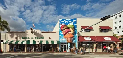 a city street with a building with a large billboard of ice cream cones at B3 Best Value on Private Bedroom with Private Bathroom in Little Havana, Miami in Miami