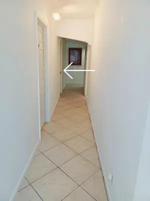 a hallway with a arrow pointing into a room at B5 Best Value on Private Bedroom with Private Bathroom in Little Havana, Miami in Miami