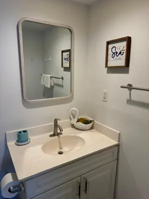 a bathroom with a sink and a mirror at Tropical ocean view 1 bedroom in Hollywood