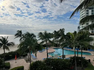 a view of the beach from the balcony of a resort at Tropical ocean view 1 bedroom in Hollywood