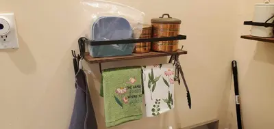 a towel rack on the side of a refrigerator at Cosy new studio with yard space in Miami in Miami