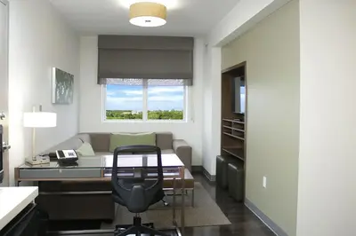 a office with a desk and a chair in a room at Element Miami Doral in Miami