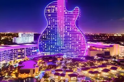 a hotel with a guitar on its facade at night at Luxury Miami Villa in North Miami