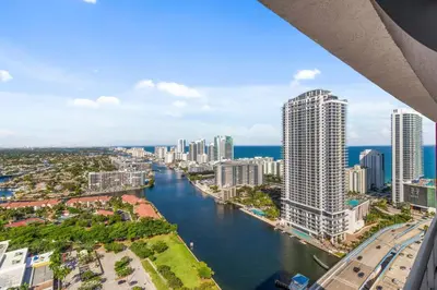 an aerial view of a city with a river and buildings at Top Floor Luxury Penthouse with Private Roof Deck in Hallandale Beach