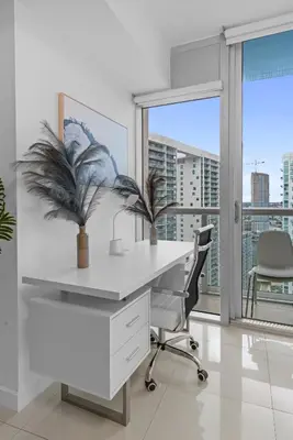 an office with a white desk and chair and a window at Studio in Miami Brickell Business District ICON Residences in Miami